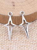 Lote de 40 colgantes de estrella fugaz de color plateado de 23 x 10 mm, aptos para hacer joyas hechas a mano de aleación de metal.