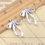 10 Uds. De dijes con lazo, pajarita de 30x21mm, colgantes de Color plata antigua, fabricación de joyería tibetana hecha a mano DIY