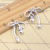 20 piezas dijes pajarita con corazón 24x20mm colgantes de Color plata antigua para hacer joyería tibetana hecha a mano DIY