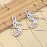 10 Uds. De dijes de caballito de mar, hipocampo de océano, 22x15mm, colgantes de Color plata antigua, fabricación de joyería tibetana hecha a mano DIY