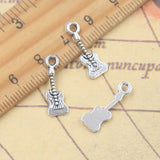 30 Uds. De dijes, instrumento encantador para guitarra, 19x6mm, colgantes de Color plata antigua, fabricación de joyería tibetana hecha a mano DIY