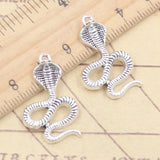Colgantes de plata tibetana de serpiente de Cobra, fabricación de joyas antiguas, artesanía hecha a mano, bricolaje, 10 piezas, 28x17mm
