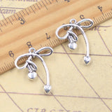 20 piezas dijes pajarita con corazón 24x20mm colgantes de Color plata antigua para hacer joyería tibetana hecha a mano DIY