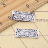 20 piezas dijes dinero 100 dólares 8x21mm colgantes de Color plata antigua fabricación DIY joyería tibetana hecha a mano