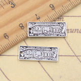 20 piezas dijes dinero 100 dólares 8x21mm colgantes de Color plata antigua fabricación DIY joyería tibetana hecha a mano