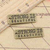 10pcs Charms Strong Is Beautiful 10x27mm Tibetan Bronze Silver Color Pendants Antique Jewelry Making DIY Handmade Craft