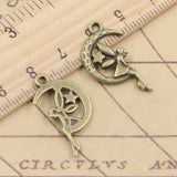 20 piezas de dijes de hada, ángel, luna y estrella, 25 x 14 mm, tibetano, bricolaje, joyería retro, pulsera, collar, colgante de color bronce antiguo y plata. 