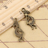 20pcs Charms Native Kokopelli 24x9mm Tibetan Bronze Silver Color Pendants Antique Jewelry EF3656