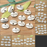 Assorted tibetan silver tone family lettering oval shaped charms to pick