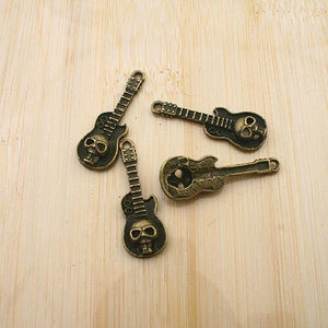 20pcs antiqued bronze muisc instrument skull style pendant g1730